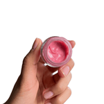 Sample-size pink lip balm in a jar