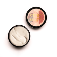 Belly butter for stretch marks, open jar showing cream